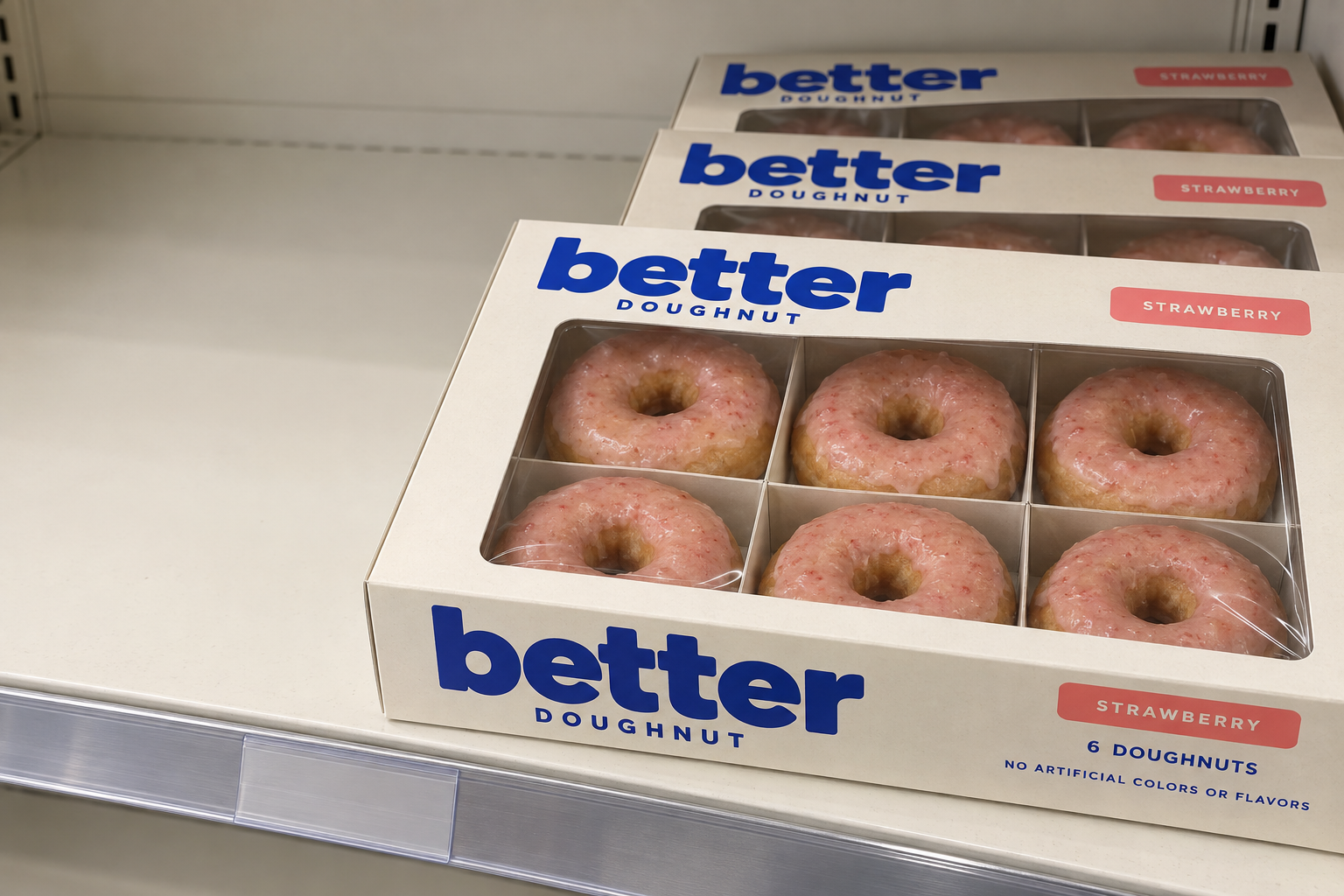 Concept packaging: a cobalt blue and ivory Better Doughnut six-pack on a grocery shelf. AI-generated packaging concept.
